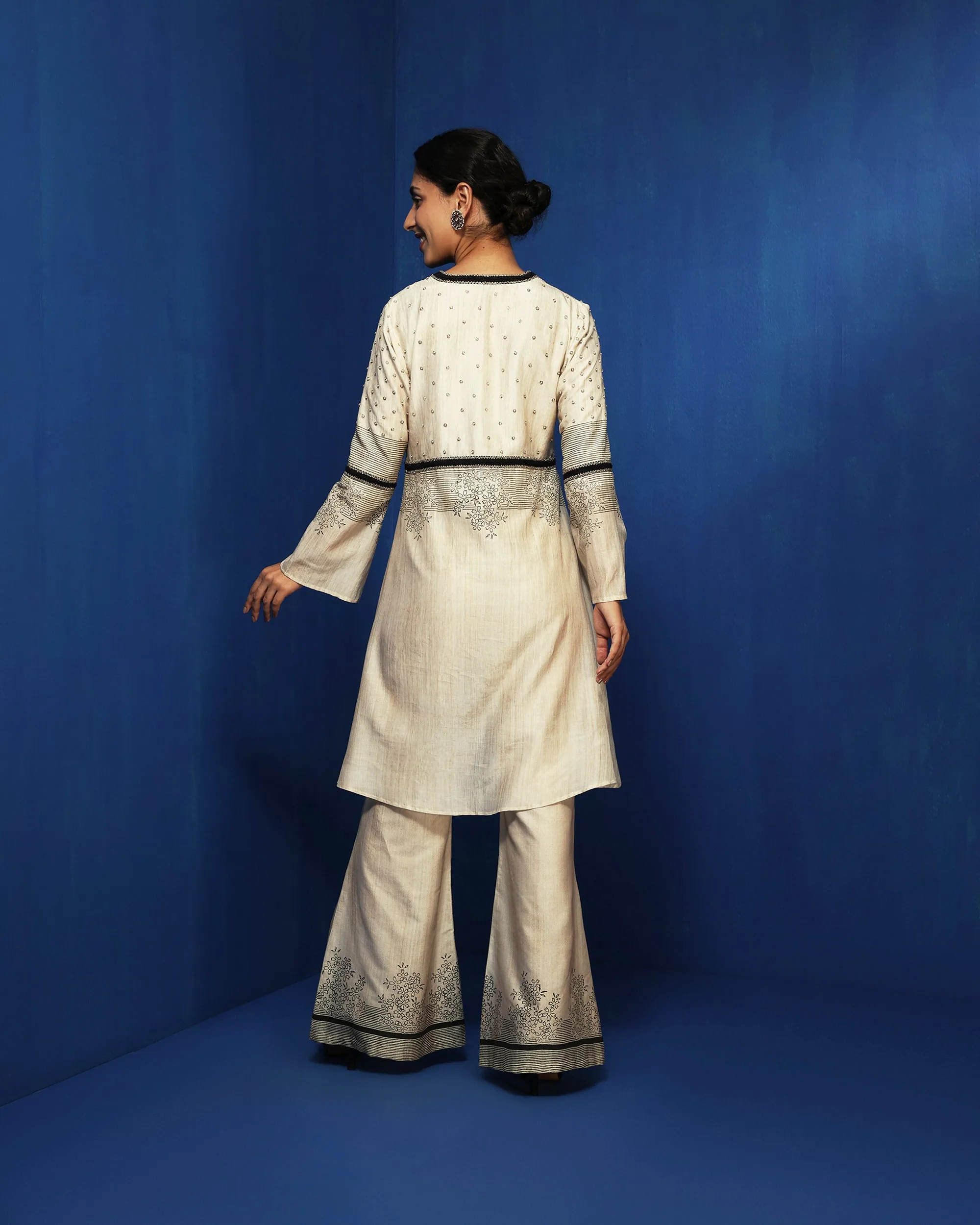 Ecru bell bottom pants